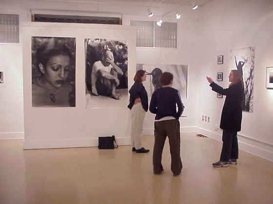 guests in front of big prints